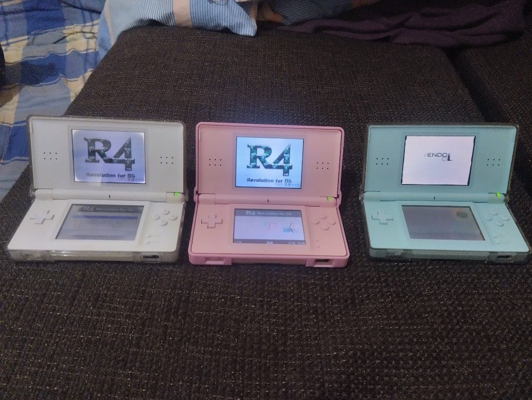 Nintendo ds lite with defects set (Category: Nintendo) located in Baguio. Submitted by clumzy.v2 (Listing ID 1320325655, Image 1). Description: white has screen lines on touchpad, and needs to replace both of the screen all buttons working well with stylus no r4, no charger, with case. pink has a little scratch looks brand new all buttons working properly touchscreen needs to be recalibrated or replaced with stylus and case no charger no r4 skybl