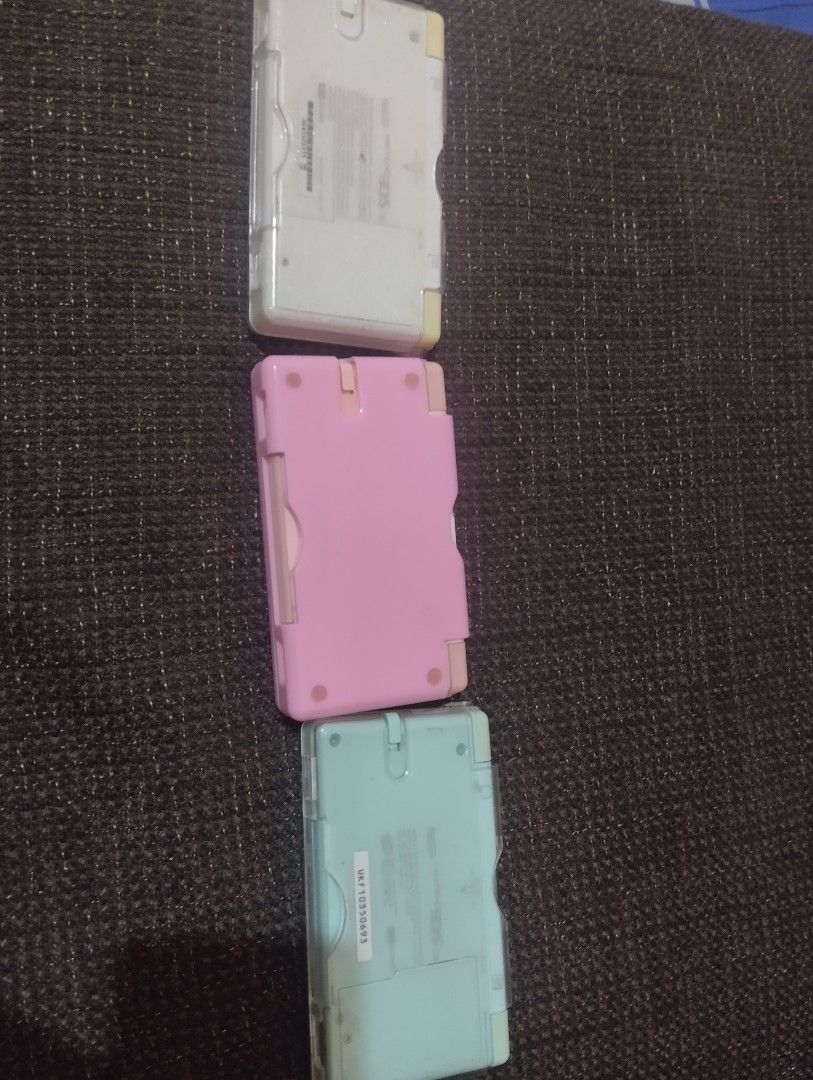 Nintendo ds lite with defects set (Category: Nintendo) located in Baguio. Submitted by clumzy.v2 (Listing ID 1320325655, Image 2). Description: white has screen lines on touchpad, and needs to replace both of the screen all buttons working well with stylus no r4, no charger, with case. pink has a little scratch looks brand new all buttons working properly touchscreen needs to be recalibrated or replaced with stylus and case no charger no r4 skybl