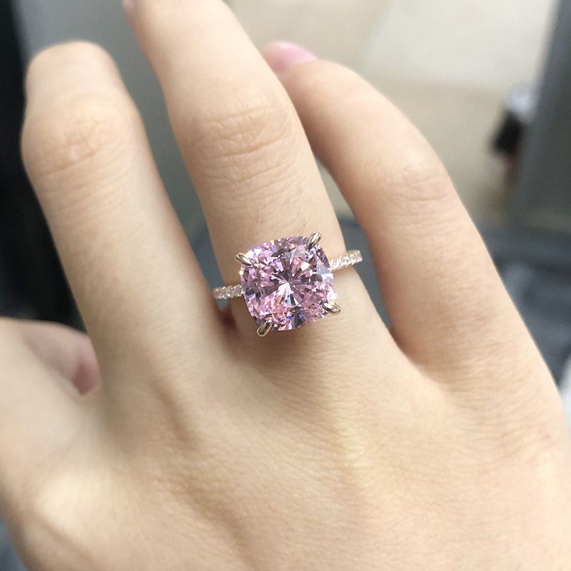 Pink sapphire engagement ring. (Category: Rings) located in Taguig. Submitted by little_toto (Listing ID 1320235472, Image 2). Description: This engagement ring features a pink sapphire stone set in a rose gold-plated sterling silver band (S925). A sparkling white stone accents each side of the ring. This romantic ring is the perfect choice for someone looking for a colorful engagement ring. Metal: Sterling silver, S925. Metal polish: Rose gold. 