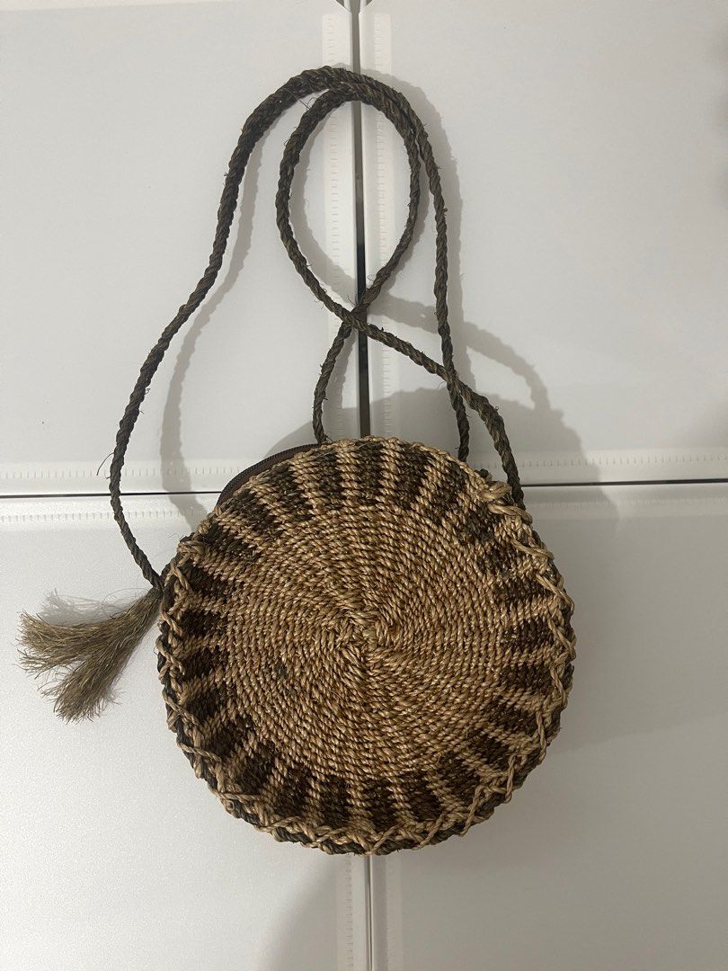 Rattan sling bag (Category: Beach Bags) located in Quezon City. Submitted by jadeeclutterz (Listing ID 1320345432, Image 1). Description: 51 inches sling, not adjustable 7.5 inches diameter 2.5 inches thick No lining.
