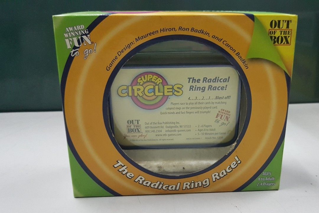 Super Circles The Radical Ring Face card game (Category: Board Games & Puzzles) located in Quezon City. Submitted by whizdepot (Listing ID 1319747359, Image 2). Description: "Super Circles: The Radical Ring Race! Players race to play all their cards by matching colored rings on the previously played card. Quick minds and fast fingers will triumph!" Part of the publisher's Fun to Go card game series, this tin contains 72 cards, each picturing 4 co