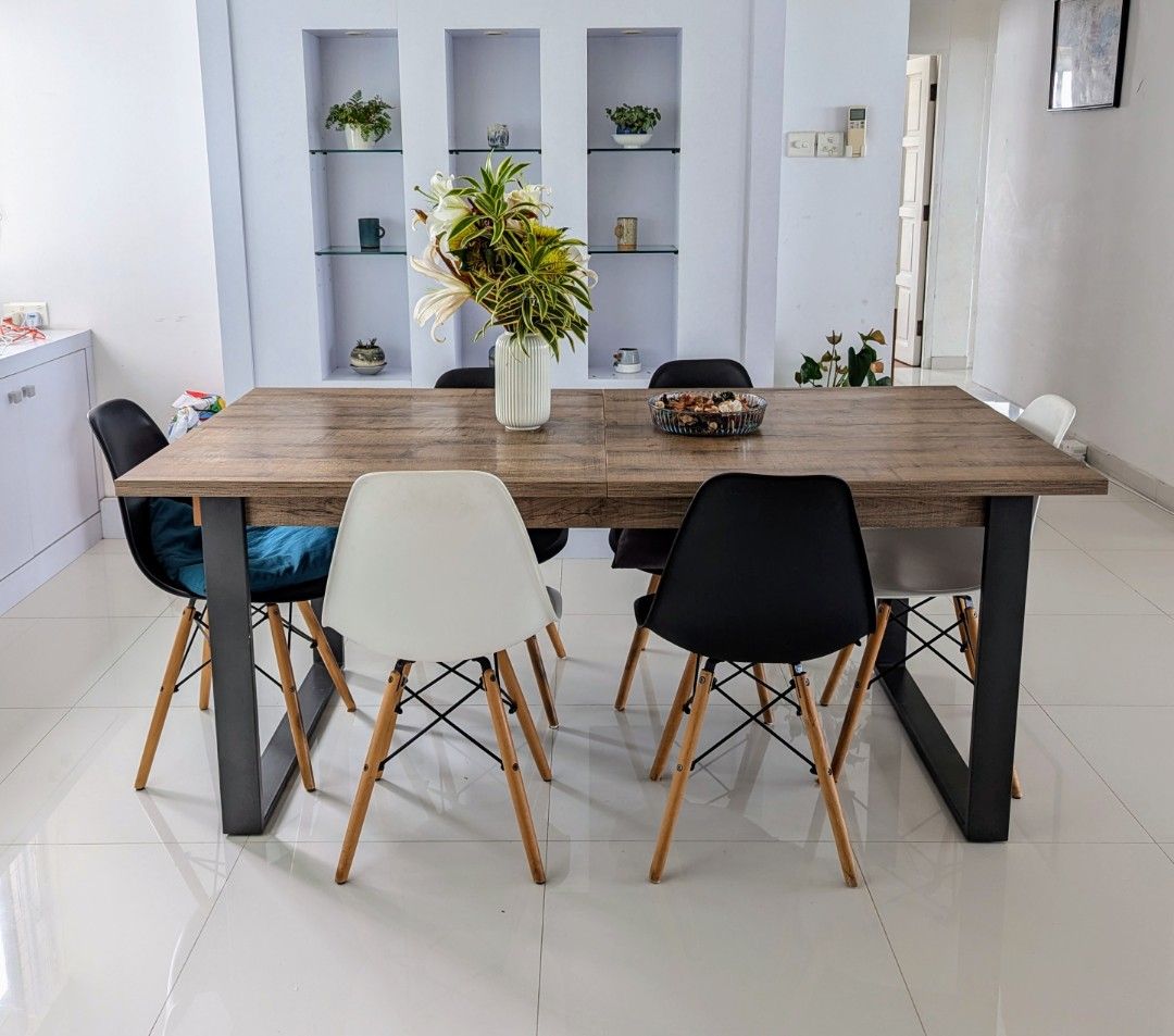Extendable dining table (Category: Tables & Sets) located in Singapore. Submitted by marcollo (Listing ID 1320475067, Image 3). Description: Solid and functional extendable table. The top is made of laminated wood panels, that only have minor defects in some edges where the lamination has lifted up a little (see last pictures). The legs are made of strong and sturdy metal material. Legs can be unscrewed and detached, in order to move it to the ne