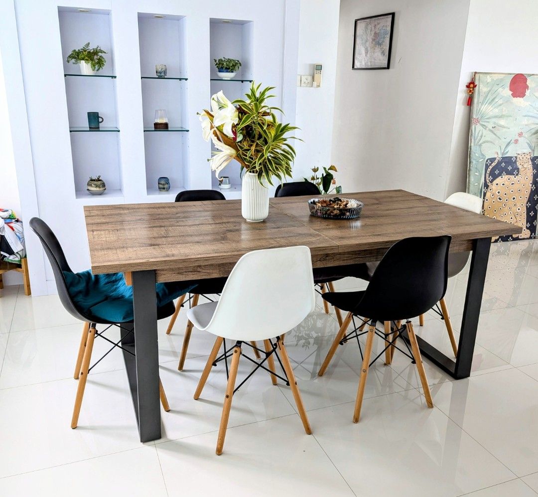 Extendable dining table (Category: Tables & Sets) located in Singapore. Submitted by marcollo (Listing ID 1320475067, Image 1). Description: Solid and functional extendable table. The top is made of laminated wood panels, that only have minor defects in some edges where the lamination has lifted up a little (see last pictures). The legs are made of strong and sturdy metal material. Legs can be unscrewed and detached, in order to move it to the ne