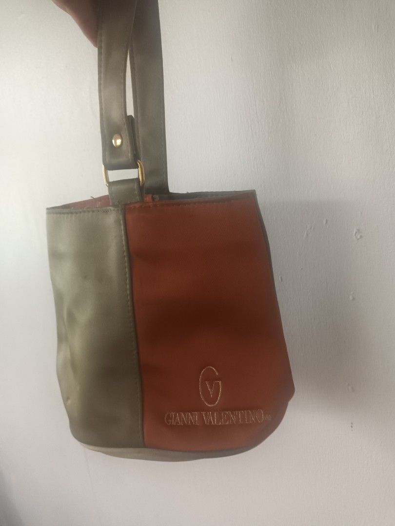 Gianni Valentino Clutch Bag (Category: Clutches) located in Quezon City. Submitted by dphnhere (Listing ID 1320448576, Image 2). Description: Gianni Valentino Clutch Half-Gray Half-Orange Bag Some stains here and there *Prices are negotiable.
