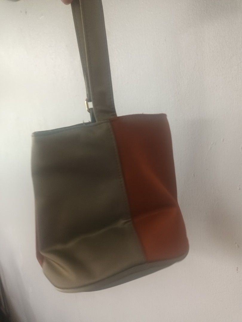 Gianni Valentino Clutch Bag (Category: Clutches) located in Quezon City. Submitted by dphnhere (Listing ID 1320448576, Image 3). Description: Gianni Valentino Clutch Half-Gray Half-Orange Bag Some stains here and there *Prices are negotiable.