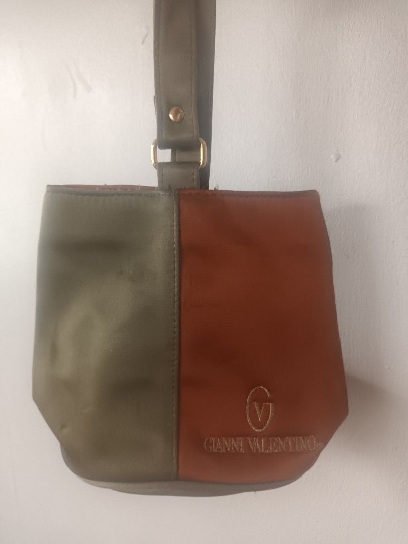 Gianni Valentino Clutch Bag (Category: Clutches) located in Quezon City. Submitted by dphnhere (Listing ID 1320448576, Image 1). Description: Gianni Valentino Clutch Half-Gray Half-Orange Bag Some stains here and there *Prices are negotiable.