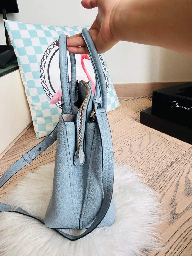 Kate Spade Margaux Bag (Category: Luxury Bags & Wallets) located in Santa Rosa. Submitted by rina.rina3 (Listing ID 1320415637, Image 2). Description: Kate Spade Margaux Bag Sourced from 🇯🇵 Japan Light blue with mix of light gray color Very nice leather and very sturdy With 3 compartments, care card and original dust bag With minimal signs of usage but overall looks new Bag dimension all in inches, LXWXH 12.5in x 5.5in x 10.5in Bag total height