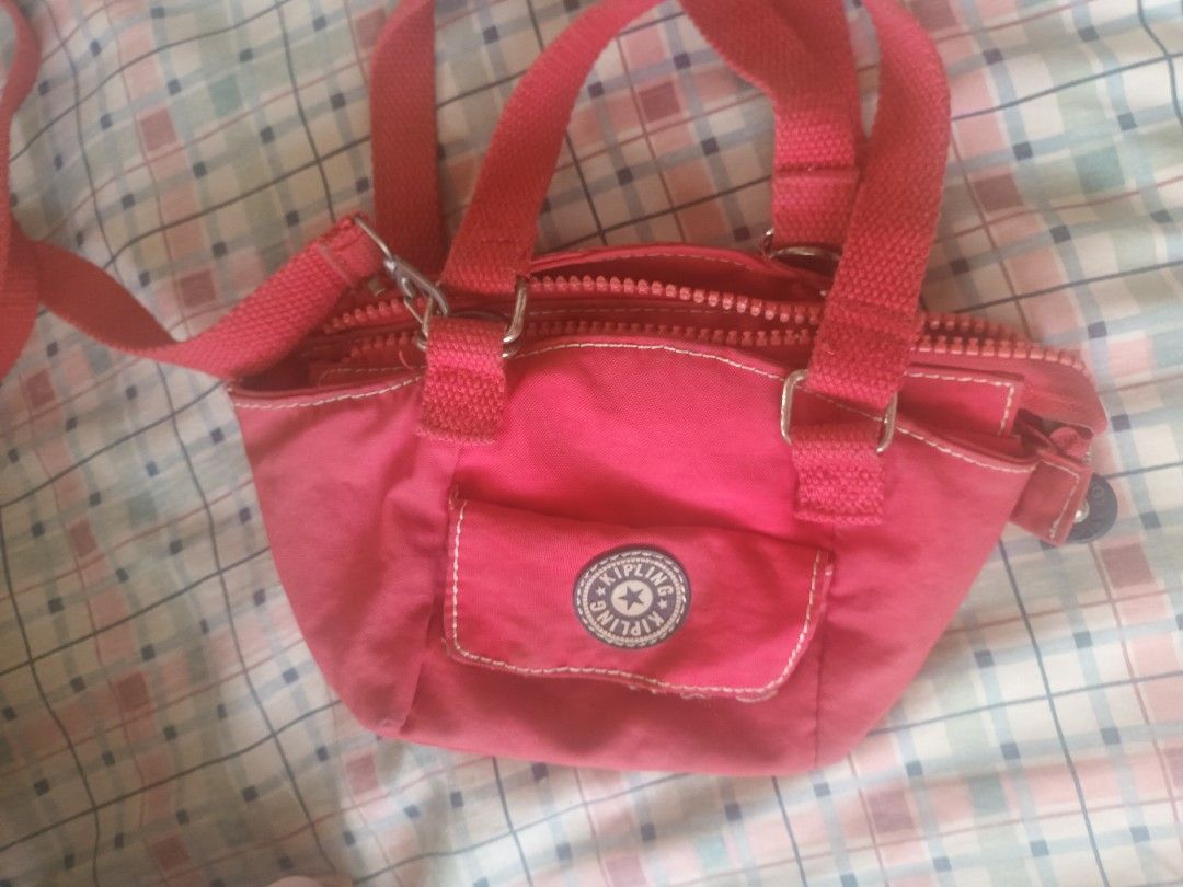 Kipling Mini Red Shoulder Bag (Category: Cross-body Bags) located in Quezon City. Submitted by dphnhere (Listing ID 1320447292, Image 2). Description: ORIGINAL Kipling Cross-body / Shoulder Bag *Prices are negotiable - Perfect bag for kids to bring during school - Also good for extra compartment when going out RFS: Don't use it anymore.
