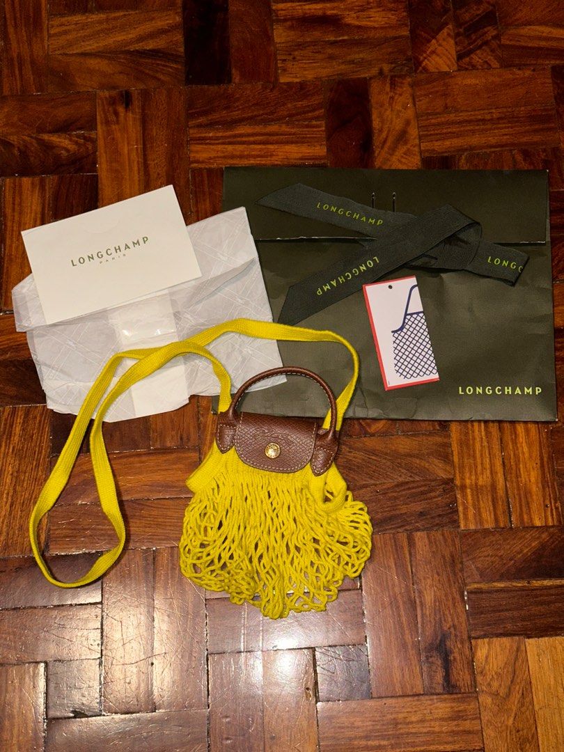 Authentic Longchamp Le Pliage Filet XS in Yellow (Category: Luxury Bags & Wallets) located in Quezon City. Submitted by cstuff_forsale (Listing ID 1320543103, Image 1). Description: Used 2x twice! PLS ONLY CHAT IF URE A SURE BUYER. PLS READ THE DETAILS HERE BEFORE MESSAGING Bought from Longchamp mismo. SRP is 6550. This is authentic. AUTHENTIC. Super sulit na since srp is 6550 + Longchamp increases their price every year COMPLETE INCLUSIONS 1. Pa