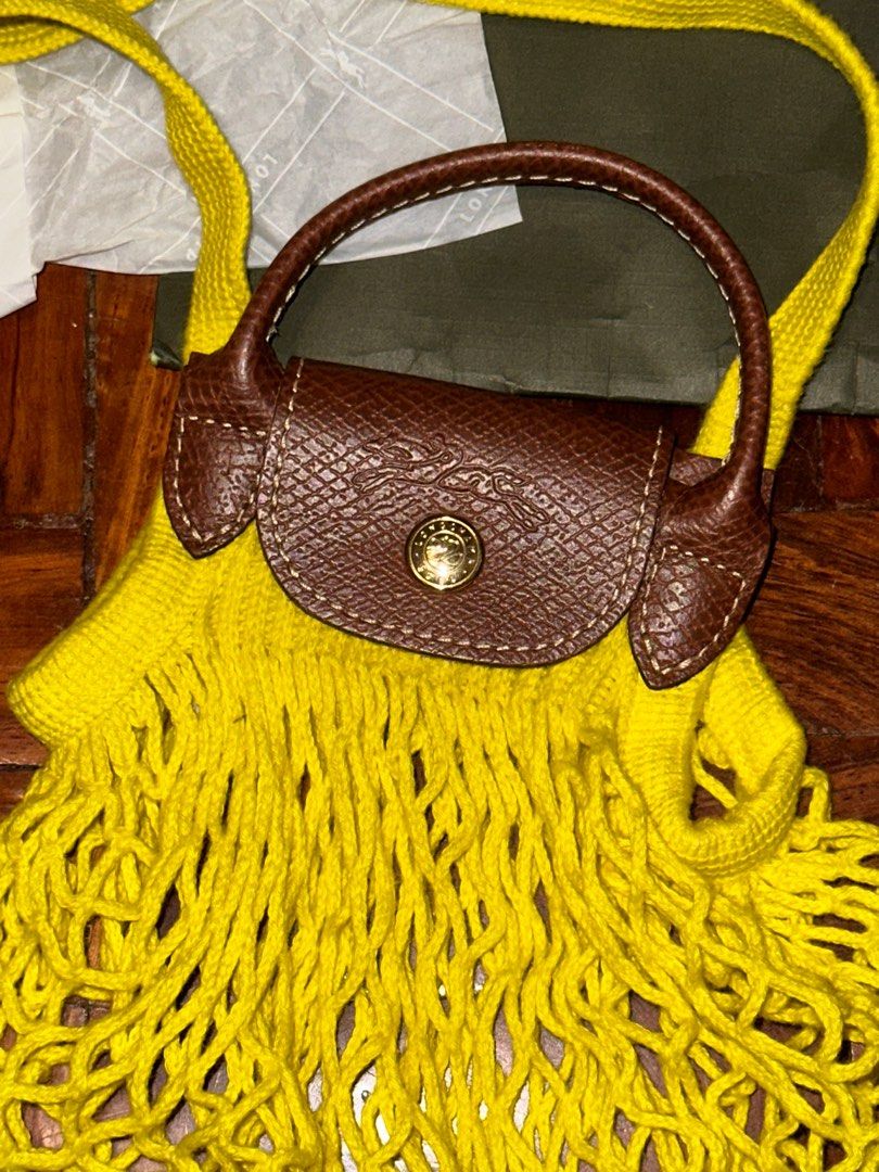 Authentic Longchamp Le Pliage Filet XS in Yellow (Category: Luxury Bags & Wallets) located in Quezon City. Submitted by cstuff_forsale (Listing ID 1320543103, Image 2). Description: Used 2x twice! PLS ONLY CHAT IF URE A SURE BUYER. PLS READ THE DETAILS HERE BEFORE MESSAGING Bought from Longchamp mismo. SRP is 6550. This is authentic. AUTHENTIC. Super sulit na since srp is 6550 + Longchamp increases their price every year COMPLETE INCLUSIONS 1. Pa