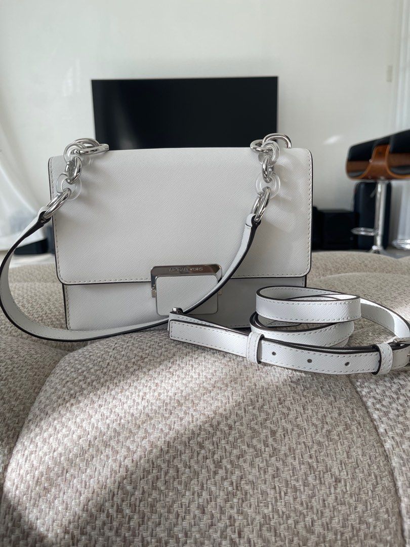 MK White Leather Small Cythia Shoulder Bag (Category: Luxury Bags & Wallets) located in Las Pinas. Submitted by angela_allyson (Listing ID 1320524577, Image 2). Description: Silver Hardware 2 sling available Good as New never been used Original Price: $226 Selling Price: 7,000.