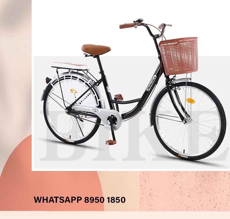 Lady riding bike with baby in bag best sale