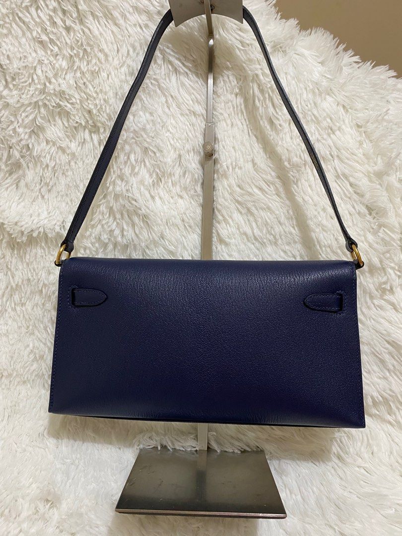 Kelly Elan/Pochette (Category: Shoulder Bags) located in Makati City. Submitted by secondlyf (Listing ID 1320624740, Image 2). Description: 🌙 Kelly Elan/Pochette in Midnight Blue Chevre Leather 🌙 Elevate your elegance with this stunning pochette, crafted from genuine chevre leather and adorned with luxurious gold hardware (GHW). Its midnight blue hue exudes timeless sophistication and class. Shipping will be shouldered by the buyer.