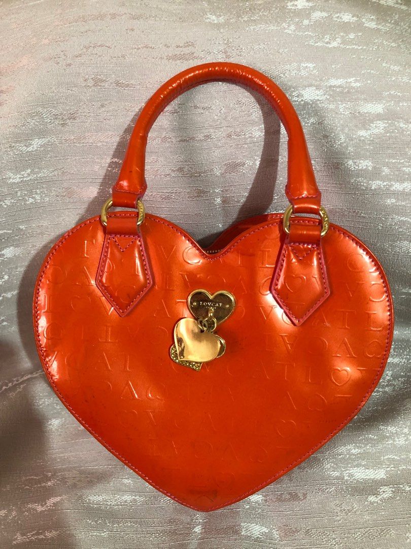 LOVCAT Orange Heart Bag (Category: Shoulder Bags) located in Angeles City. Submitted by Archive21 (Listing ID 1320702841, Image 1). Description: Good Condition with only minmal signs of wear.