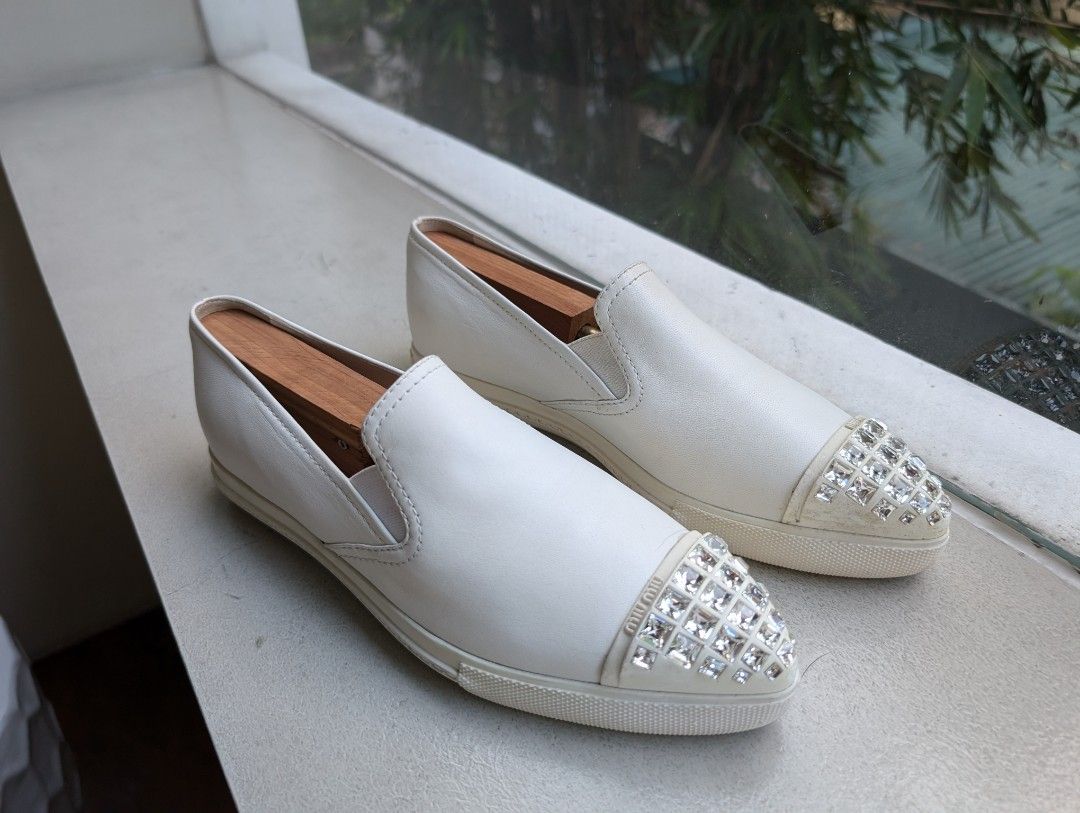 Miu Miu Leather Slip-on Sneakers (Category: Sneakers) located in Pasig City. Submitted by ejereyes (Listing ID 1320671325, Image 1). Description: Authentic. Pre-loved ❤️ Size 37 ½ Condition is as good as new. RFS: No longer being used Pickup from Ugong, Pasig.