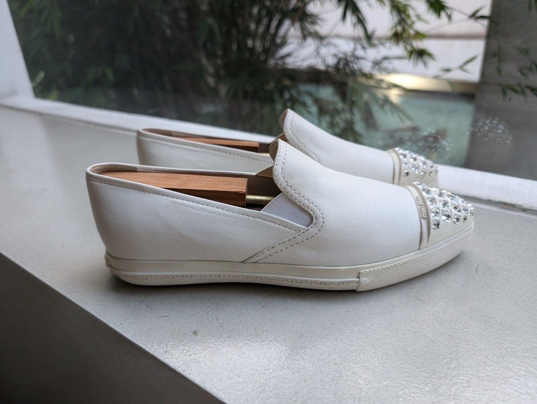 Miu Miu Leather Slip-on Sneakers (Category: Sneakers) located in Pasig City. Submitted by ejereyes (Listing ID 1320671325, Image 3). Description: Authentic. Pre-loved ❤️ Size 37 ½ Condition is as good as new. RFS: No longer being used Pickup from Ugong, Pasig.