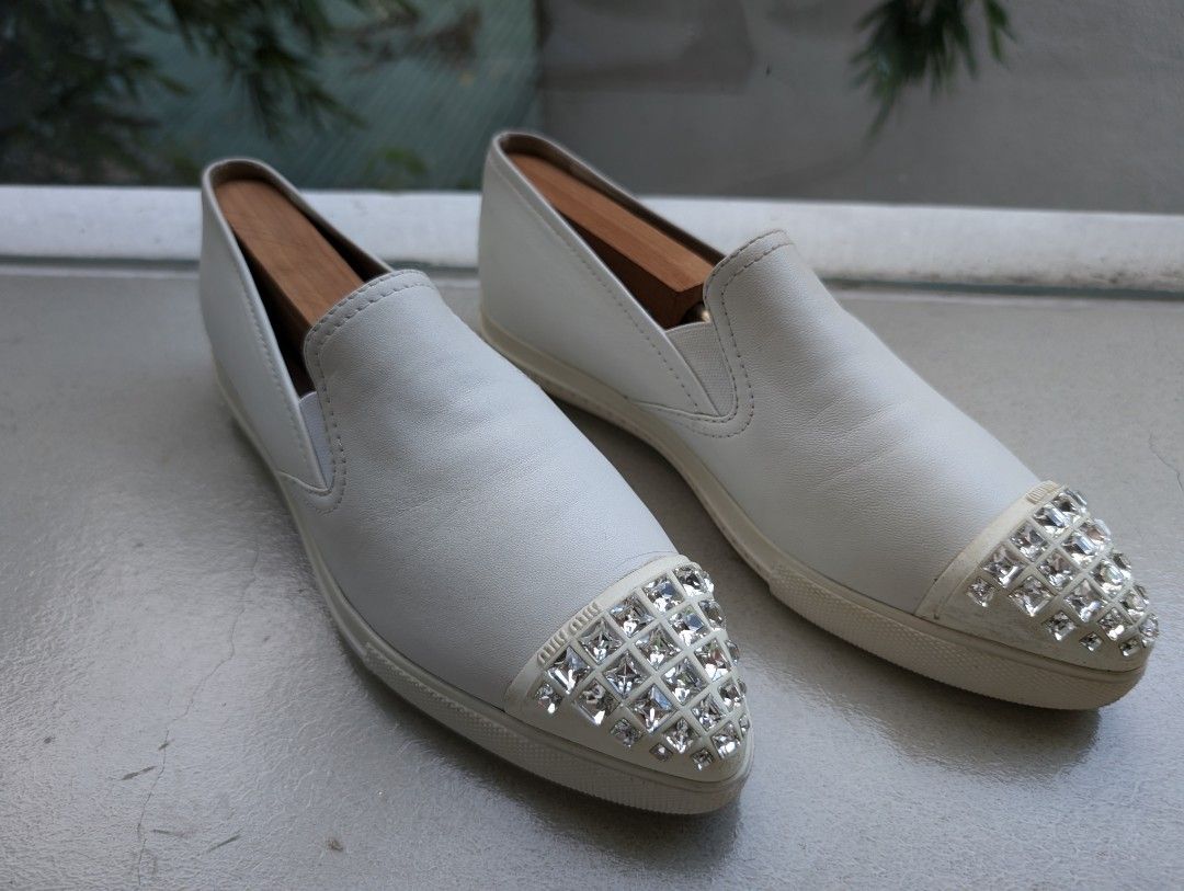 Miu Miu Leather Slip-on Sneakers (Category: Sneakers) located in Pasig City. Submitted by ejereyes (Listing ID 1320671325, Image 2). Description: Authentic. Pre-loved ❤️ Size 37 ½ Condition is as good as new. RFS: No longer being used Pickup from Ugong, Pasig.