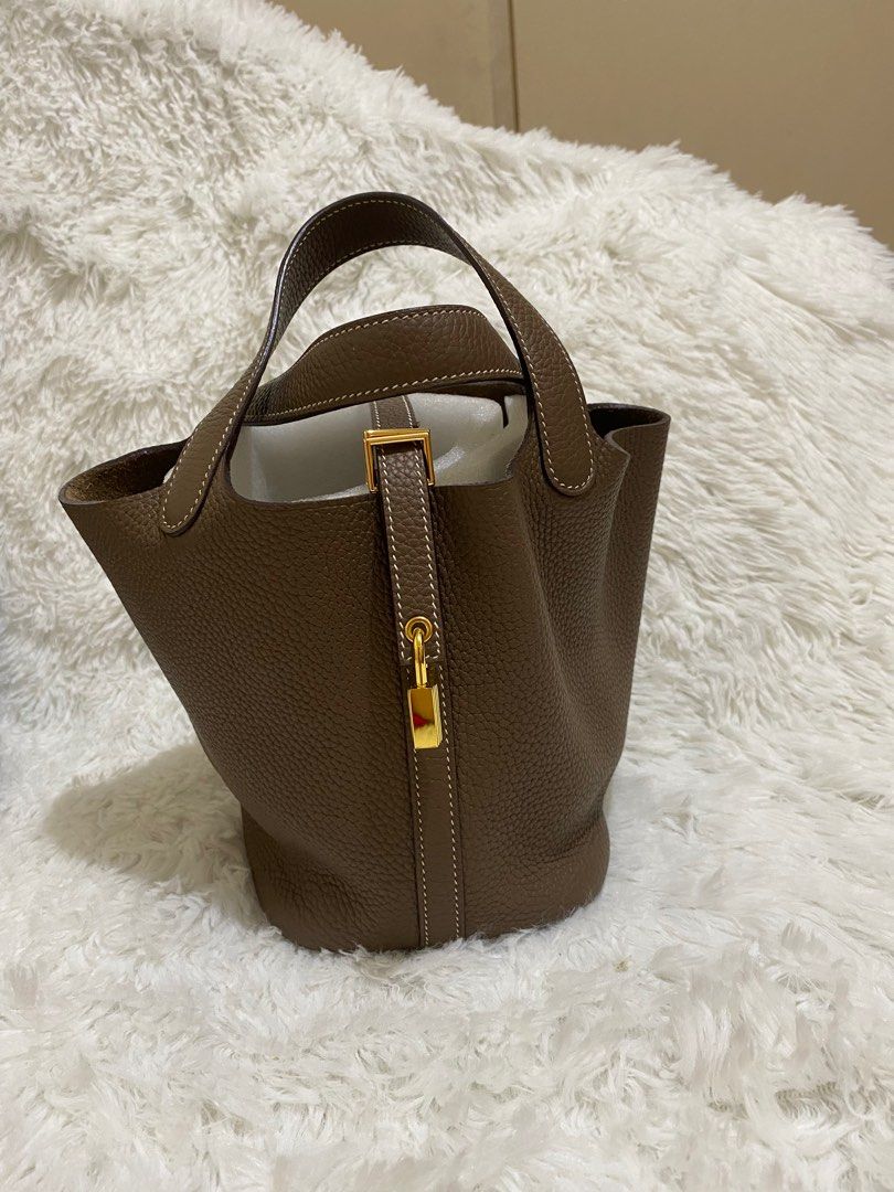 Picotin 18 in Genuine Clemence Leather (Category: Purses & Pouches) located in Makati City. Submitted by secondlyf (Listing ID 1320723167, Image 2). Description: Discover luxury redefined with our exquisite Picotin 18 bag, crafted from genuine Clemence leather and adorned with stunning gold hardware. Elevate your style with timeless elegance and unmatched quality. Perfect for those who appreciate the finer things in life, Indulge in the beauty of