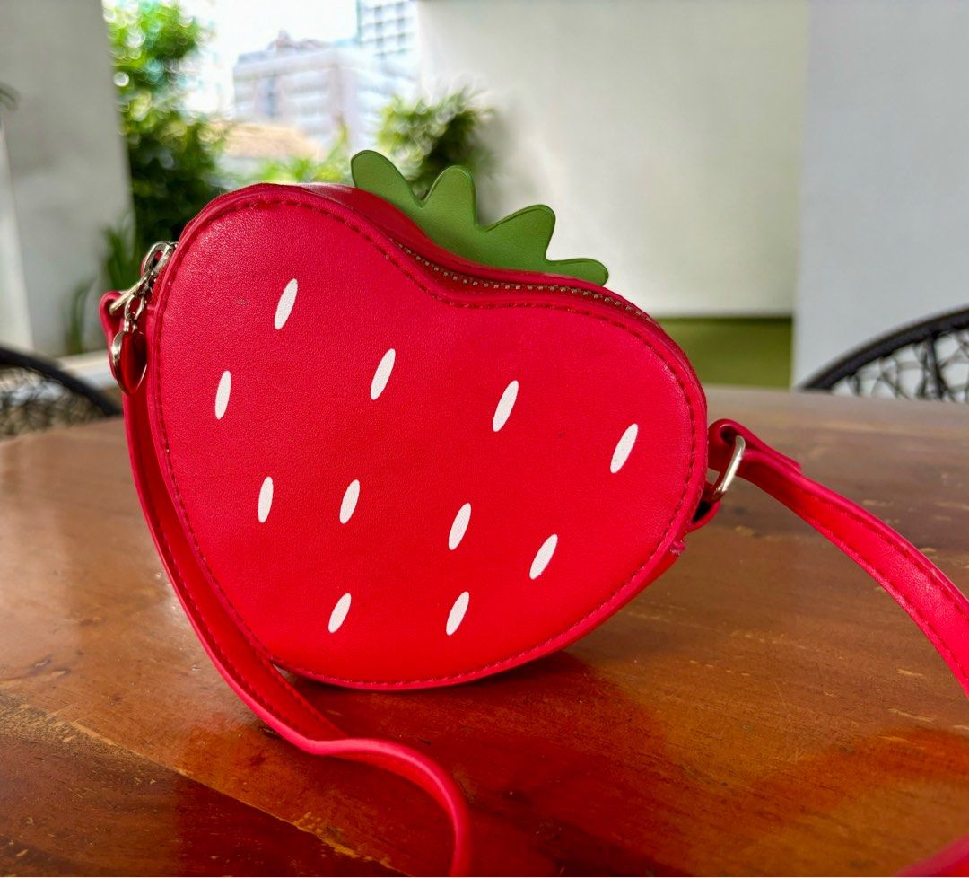 Uncage strawberry crossbody micro bag in red (Category: Cross-body Bags) located in Pasig City. Submitted by lexans_bentables (Listing ID 1320695681, Image 1). Description: Uncage strawberry crossbody micro bag in red ❣️ CLEARANCE SALE ❣️ - super cute micro bag with strawberry design - can fit card holder and small bifold wallet - long, adjustable strap - normal signs of use NOTE❗️❗️❗️ - lining has stain as can be seen in the last pic, but not st