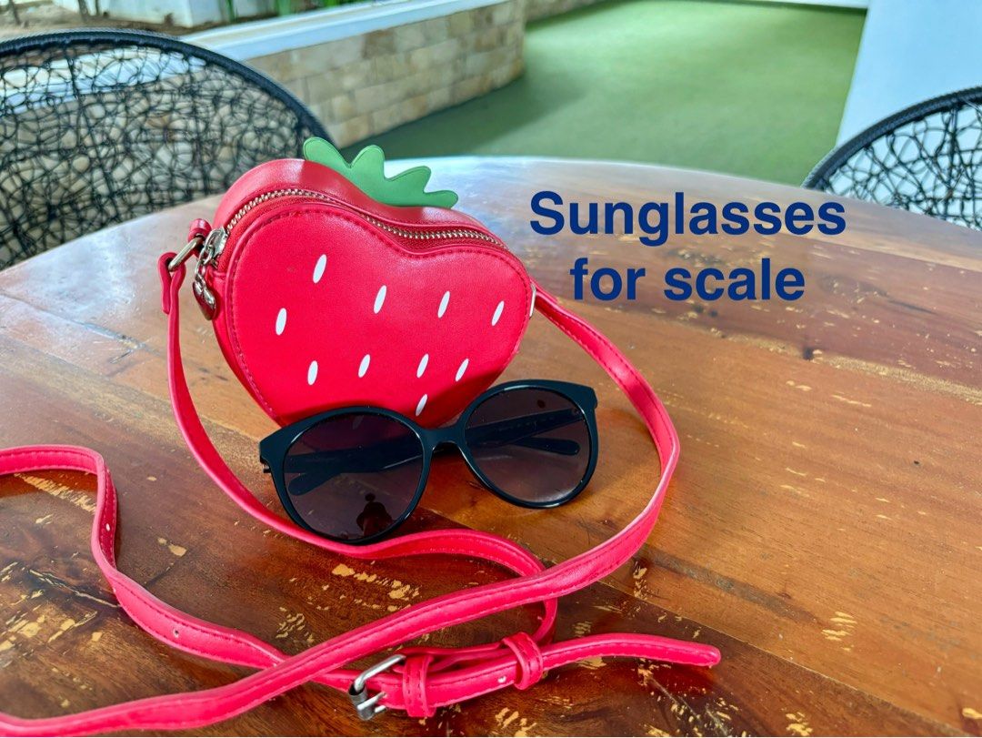 Uncage strawberry crossbody micro bag in red (Category: Cross-body Bags) located in Pasig City. Submitted by lexans_bentables (Listing ID 1320695681, Image 3). Description: Uncage strawberry crossbody micro bag in red ❣️ CLEARANCE SALE ❣️ - super cute micro bag with strawberry design - can fit card holder and small bifold wallet - long, adjustable strap - normal signs of use NOTE❗️❗️❗️ - lining has stain as can be seen in the last pic, but not st