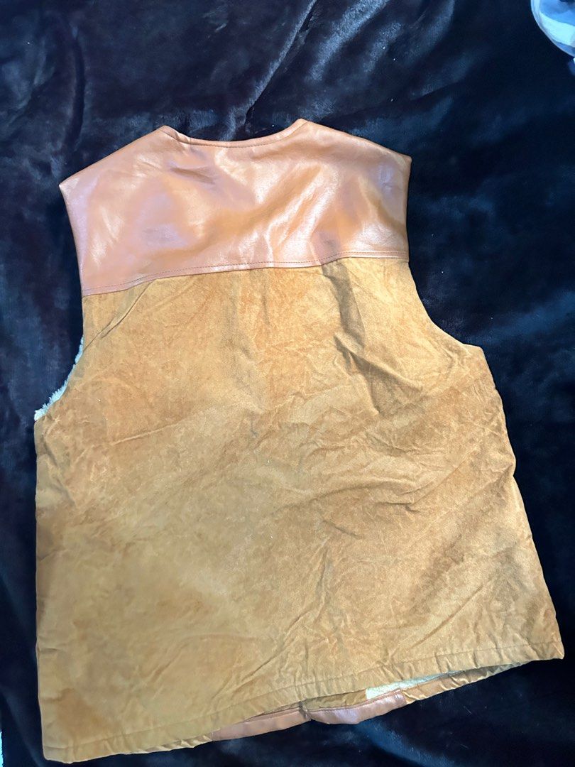 Sherpa Leather vest (suede+pu leather) (Category: Coats, Jackets and Outerwear) located in Daraga. Submitted by swiftted (Listing ID 1320793554, Image 3). Description: LL on tag 21”x25” dimension No issue Good as new MOP: gcash/bank transfer (bdo)/maya Coourier: jnt/lbc.