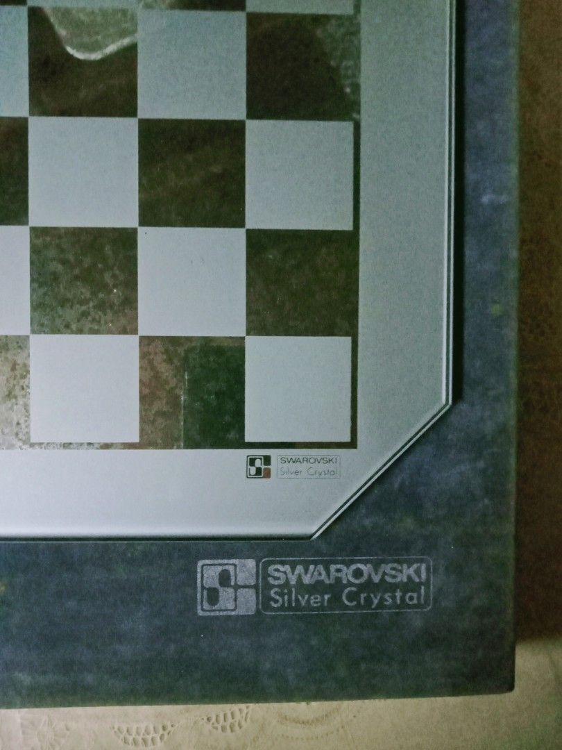 Swarovski chess silver crystal board only (Category: Board Games & Puzzles) located in Taytay. Submitted by ddxdd (Listing ID 1320834968, Image 2). Description: size chess area 11 x 11 inches plus 1 1/4 inch sa sides, squares around 1 x 1 inches, no chips, with original box. board only, no chess pieces. photos with reflections, last picture reference only.