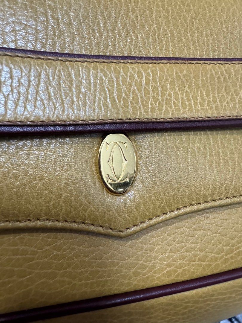 Authentic Cartier Leather Clutch Bag Yellow (Category: Clutches) located in Manila. Submitted by ganned (Listing ID 1317862734, Image 3). Description: Cartier Clutch Bag in Yellow with Authentication card and dustbag Well taken cared of by owner Inside zipper still with protective plastic Clean interior Hardware all gold No rubs, loose stitches or piping issues.
