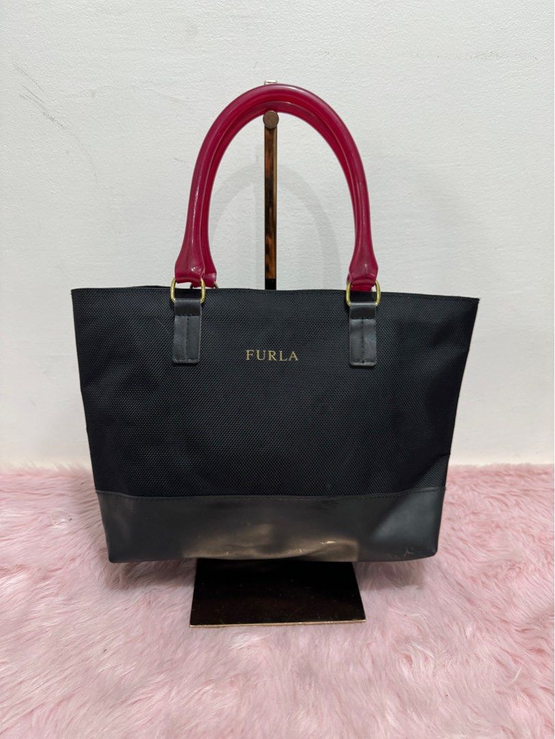 Authentic furla jelly mini handbag (Category: Luxury Bags & Wallets) located in Rizal. Submitted by houseofbell (Listing ID 1317839707, Image 1). Description: Body excellent condition Normal sign of usage inside.