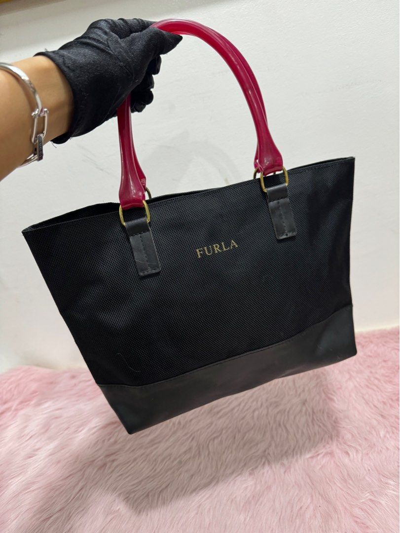 Authentic furla jelly mini handbag (Category: Luxury Bags & Wallets) located in Rizal. Submitted by houseofbell (Listing ID 1317839707, Image 3). Description: Body excellent condition Normal sign of usage inside.