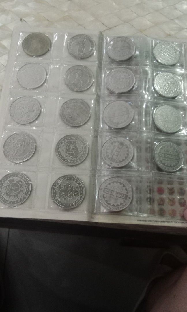Pokémon Metal Coin collection (Category: Currency) located in Bacoor. Submitted by jasspapi6 (Listing ID 1317734780, Image 3). Description: Pokémon metal coin album contains 20 silver and 1 mystery gold coin with stickers Slightly negotiable Collectors item Pay thru gcash or BDO Shipping: Grab lalamove or gogo express.