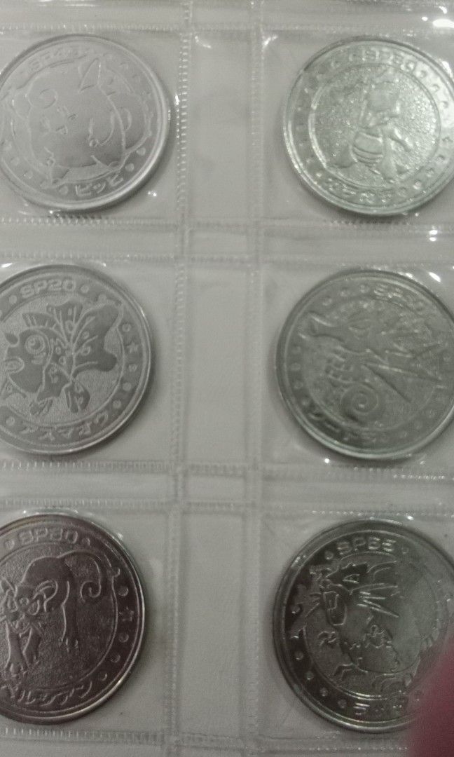 Pokémon Metal Coin collection (Category: Currency) located in Bacoor. Submitted by jasspapi6 (Listing ID 1317734780, Image 1). Description: Pokémon metal coin album contains 20 silver and 1 mystery gold coin with stickers Slightly negotiable Collectors item Pay thru gcash or BDO Shipping: Grab lalamove or gogo express.