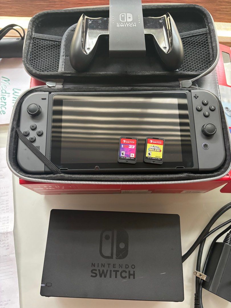 LIKE NEW NINTENDO SWITCH WITH GAMES (Category: Nintendo) located in Las Pinas. Submitted by monicasellsstuff (Listing ID 1321010285, Image 1). Description: Complete inclusions BOX, RECEIPT, JOY CON STRAPS, HDMI, SWITCH DOCK, JCON GRIP, AC ADAPTER Freebie: NINTENDO CASE With SUPER MARIO & 2K23 GAME (Super Mario with case di ko lang na picture-an) .