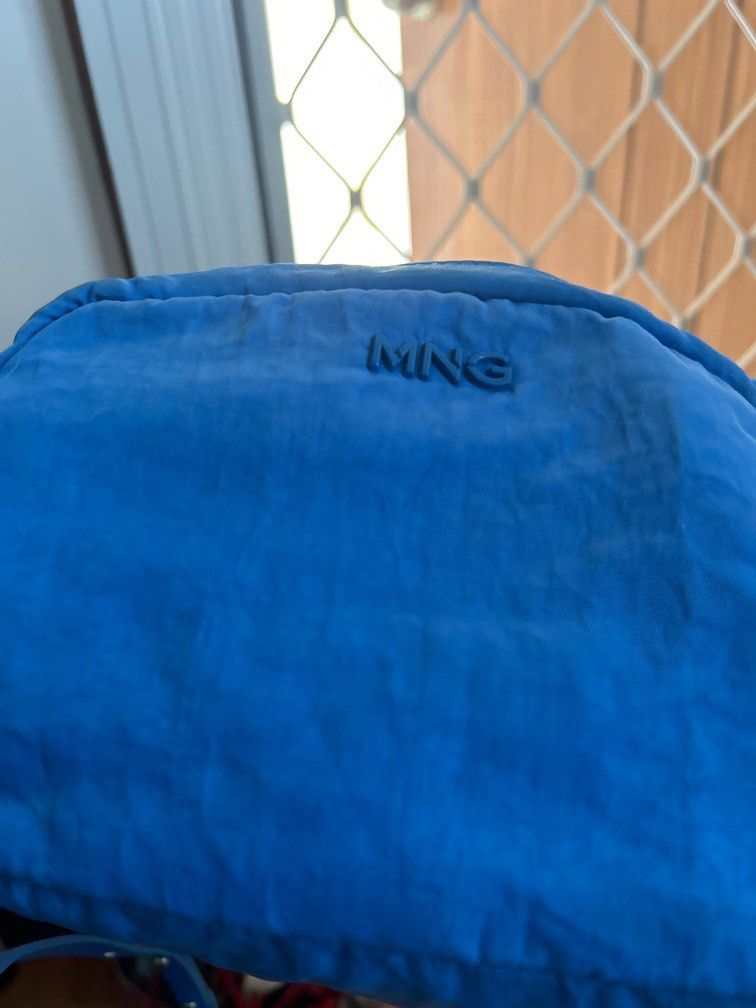 MANGO royal blue crossbody bag (Category: Cross-body Bags) located in Davao. Submitted by declutterstuff01 (Listing ID 1321001219, Image 1). Description: slightly used bag for casual wear statement piece for a normal day outfit bought in Mng moa .