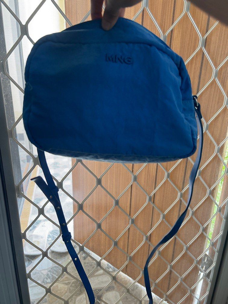 MANGO royal blue crossbody bag (Category: Cross-body Bags) located in Davao. Submitted by declutterstuff01 (Listing ID 1321001219, Image 2). Description: slightly used bag for casual wear statement piece for a normal day outfit bought in Mng moa .
