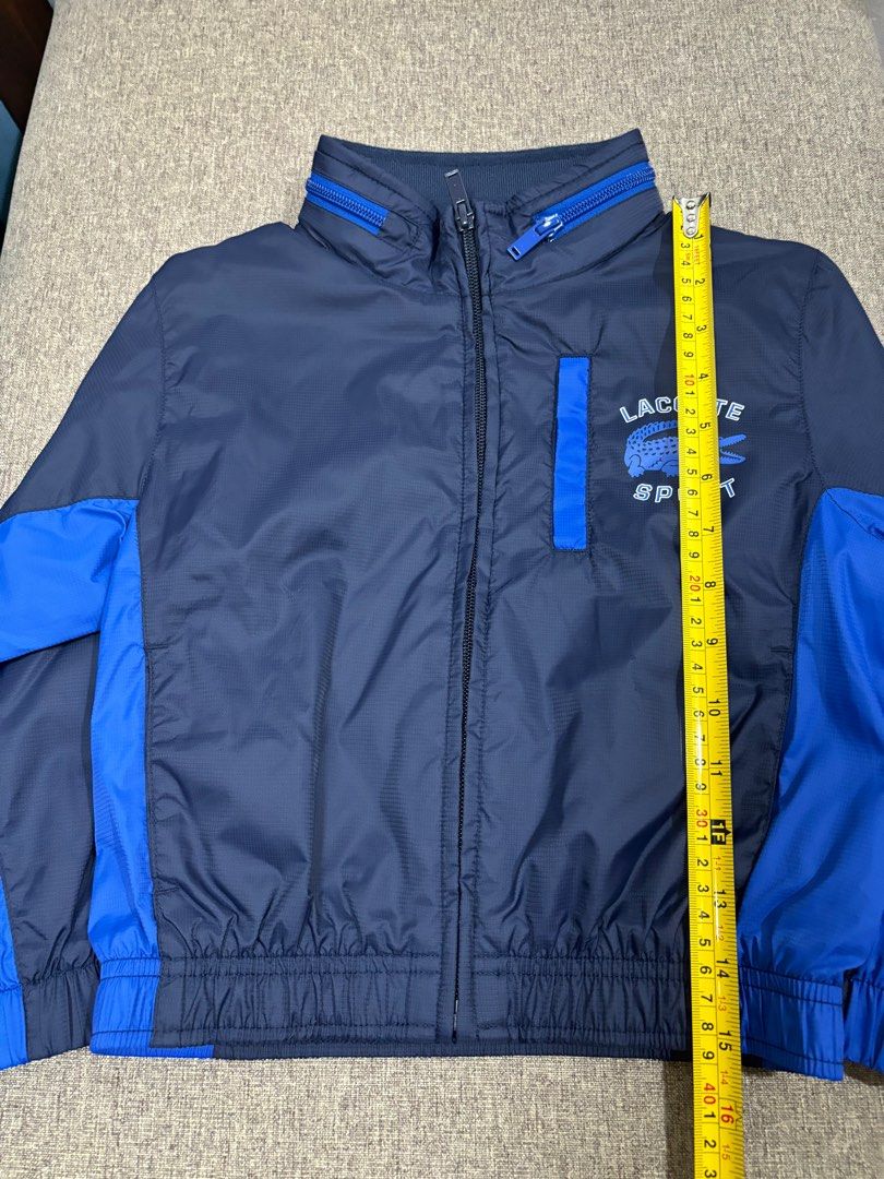 Original Lacoste Kids 2-way Jacket for 2-4 yo (Category: Coats, Jackets and Outerwear) located in Pasay City. Submitted by loved_items211 (Listing ID 1321126558, Image 2). Description: Original Lacoste bought at Rustans Makati. Used only once because my son outgrew it fast. GOOD AS NEW. NO Flaws. The hood can be folded and tucked in the collar. See photos for reference. Kindly check photos for exact measurements..
