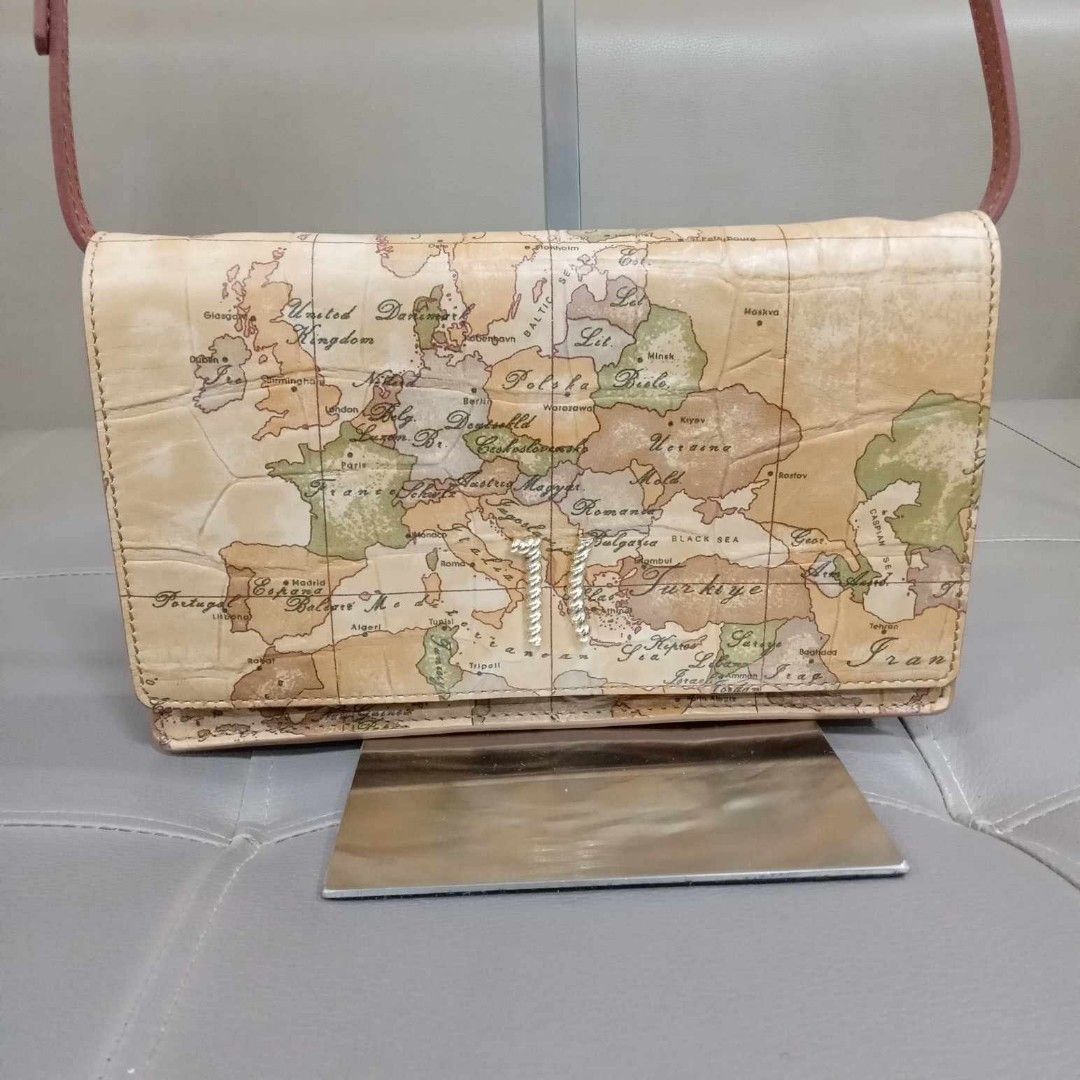 Alviero Martini Pochette With Flap Bag (Category: Luxury Bags & Wallets) located in Taguig. Submitted by esa.agustin (Listing ID 1321213936, Image 3). Description: Original Alviero Martini Pochette with flap sling bag. With box and carecard. in Neutral color. Bought in Italy..