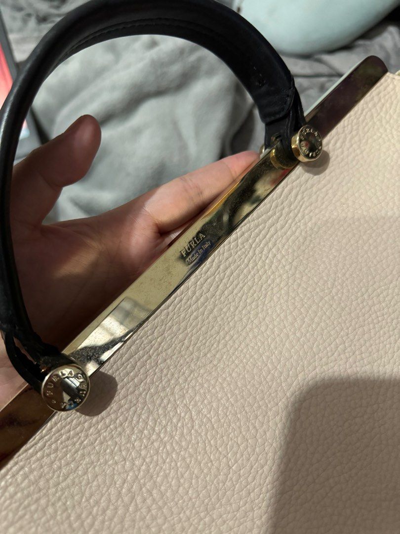 Authentic Furla Cortina bag (Large) (Category: Luxury Bags & Wallets) located in Mabalacat. Submitted by fangal_finds (Listing ID 1321178404, Image 3). Description: Authentic Furla Cortina bag (Large) Intact Rubber linings No open pipping and rubs Gold hardwares Issue: Missing sling (replacement slings are available in orange app).