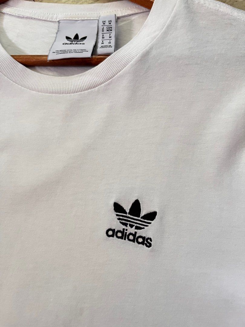 Adi trefoil essential tee (Category: Tshirts & Polo Shirts ) located in Quezon City. Submitted by charddaddy (Listing ID 1321514610, Image 2). Description: Medium-semi large fit 28x20 Excellent condition Needs wash.
