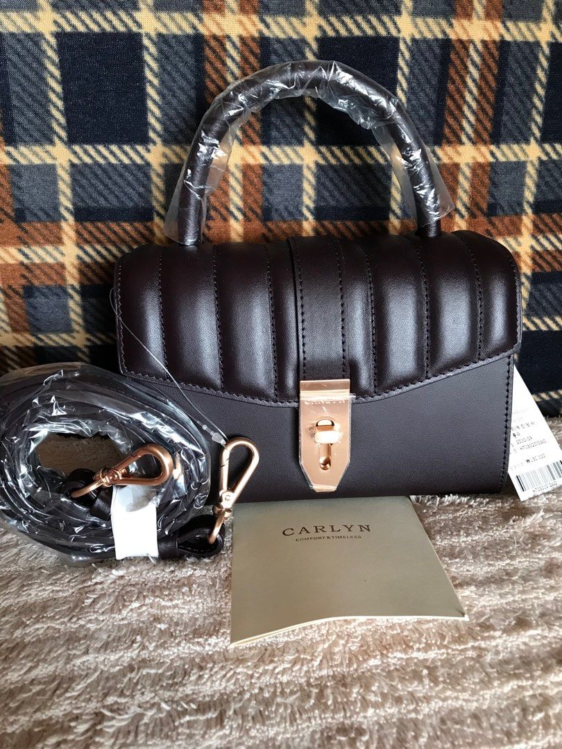 Brand New Carlyn Mellow Structured 2way bag (Category: Luxury Bags & Wallets) located in Santa Rosa. Submitted by rina.rina3 (Listing ID 1321508027, Image 3). Description: Brand New Carlyn Mellow Structured 2way bag Sourced from Korea Super nice dark plum color With removable strap Can be worn as crossbody bag or hand bag Very structured but lightweight Excellent rose gold hardwares Very pretty in person With original tag still attached. Even the
