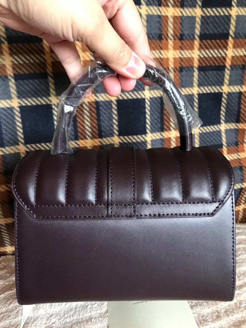 Brand New Carlyn Mellow Structured 2way bag (Category: Luxury Bags & Wallets) located in Santa Rosa. Submitted by rina.rina3 (Listing ID 1321508027, Image 2). Description: Brand New Carlyn Mellow Structured 2way bag Sourced from Korea Super nice dark plum color With removable strap Can be worn as crossbody bag or hand bag Very structured but lightweight Excellent rose gold hardwares Very pretty in person With original tag still attached. Even the