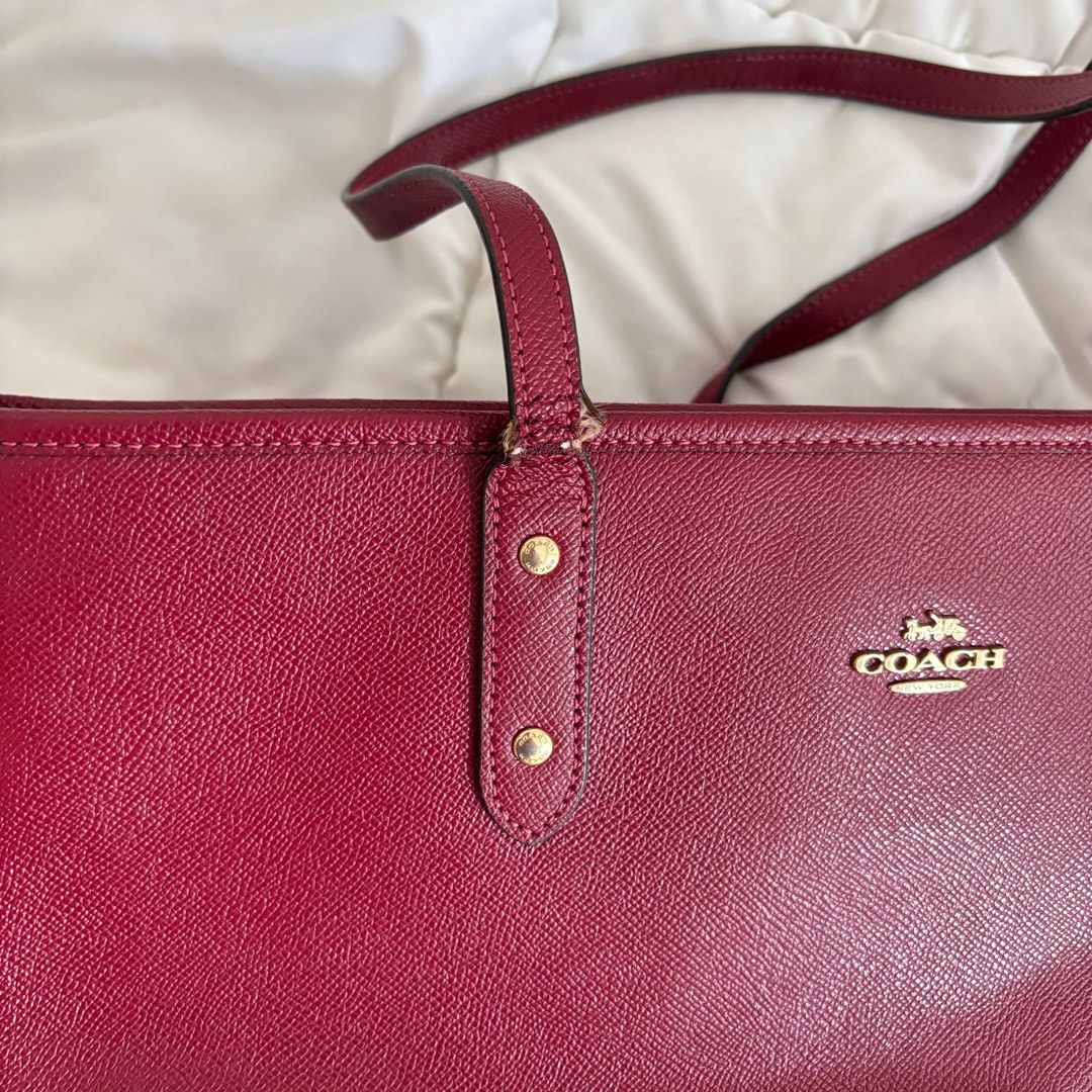 Coach Cherry Red Zip Tote Bag (Category: Luxury Bags & Wallets) located in Paranaque City. Submitted by coldbrews (Listing ID 1321494825, Image 2). Description: also bought this from carousell flaws: frayed handles as shown in listing pics rfs: don’t use this as much anymore.