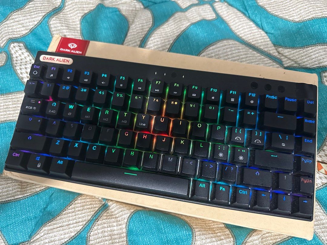 Dark Alien 75% Gaming Keyboard Tri Mode (Category: Computer Keyboard) located in Quezon City. Submitted by rrrandomsellerrr (Listing ID 1321486616, Image 1). Description: Bought for almost 3k+ and modded, tape modded, stabilizers, and lubed (might not be as evident now). Red Switches keycaps are slightly shiny but legends are not worn off Tri mode: BT, 2.4Ghz, Wired .