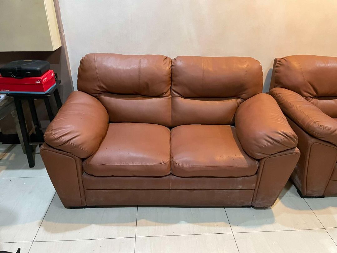 Leather Sofa Set - Mahogany (Category: Sofas) located in Quezon City. Submitted by bettygorosperemaxc (Listing ID 1321550603, Image 2). Description: - A 3-seater & 2-seater leather sofa set with custom fabric cover - Few cat scratches - Well-maintained.