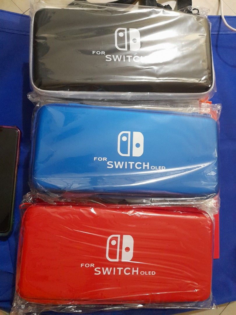 OLED SWITCH HARD POUCH (Category: Cases & Covers) located in Quezon City. Submitted by hajjasittienor (Listing ID 1321631617, Image 1). Description: BRAN NEW 💯 OLED SWITCH TEMPERD GLASS.250 OLED SWITCH.CRYSTAL CASE.300 OLED THUM GRIP.150 SWITCH CHARGER ORIG.900.