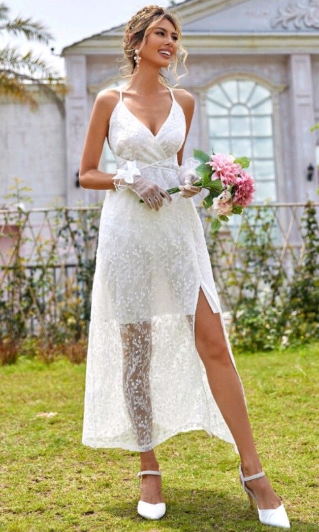 White Wedding Dress with Veil (Category: Dresses) located in Tarlac. Submitted by bebi.boo (Listing ID 1321592600, Image 2). Description: For Sale: Split Thigh, Backless Lace Cami White Dress with Veil.