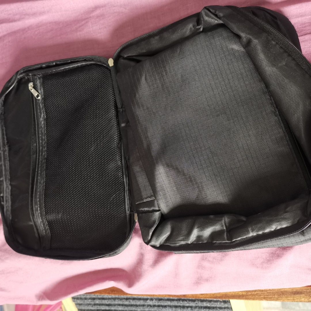 Black Travel bag / organizer / pouch / packing cube (Category: Purses & Pouches) located in Manila. Submitted by mochibibi (Listing ID 1321665644, Image 2). Description: Travel bag / organizer / pouch / packing cube With snap on mini pouch Rfs: decluttering.
