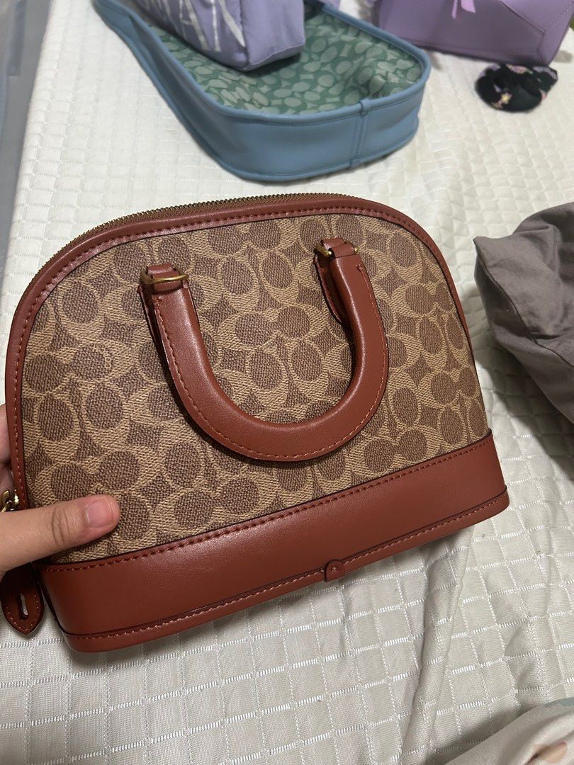Coach Revel Bag (Category: Luxury Bags & Wallets) located in Bocaue. Submitted by bagbliss2024 (Listing ID 1321656898, Image 2). Description: Last price posted!! Original! With dustbag and tag. Will include cherry charm for free (not original choach charm) Only available for lalamove or pickup.