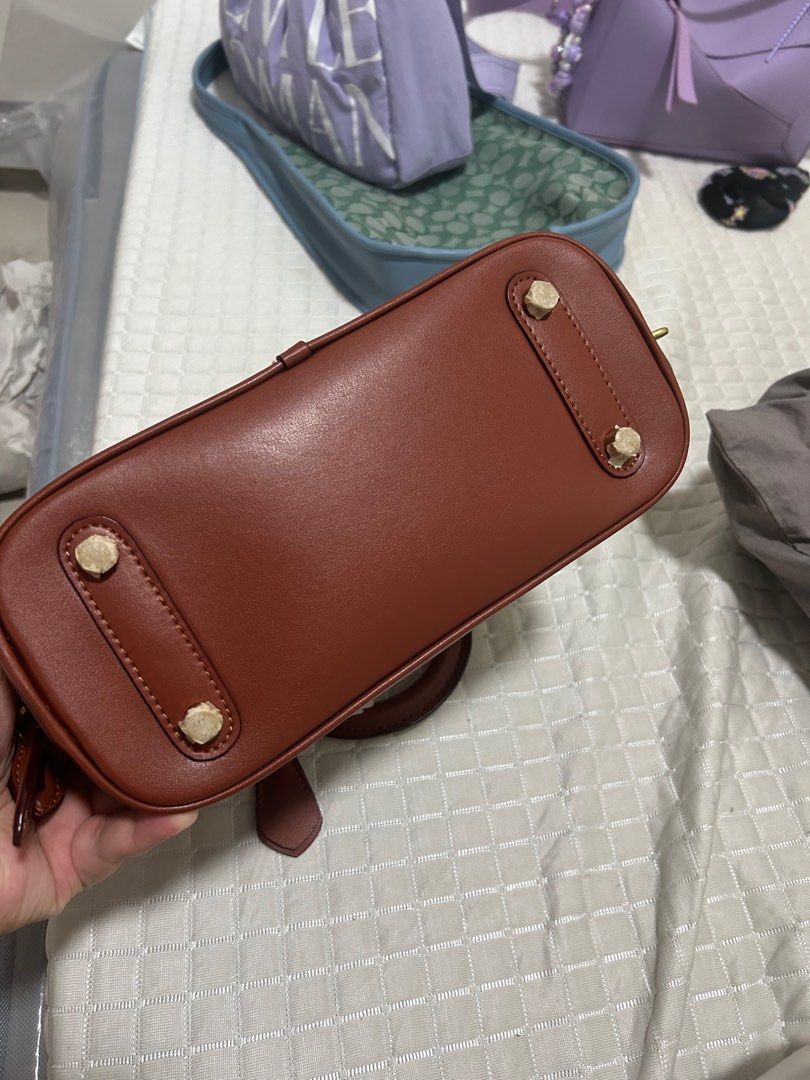 Coach Revel Bag (Category: Luxury Bags & Wallets) located in Bocaue. Submitted by bagbliss2024 (Listing ID 1321656898, Image 3). Description: Last price posted!! Original! With dustbag and tag. Will include cherry charm for free (not original choach charm) Only available for lalamove or pickup.
