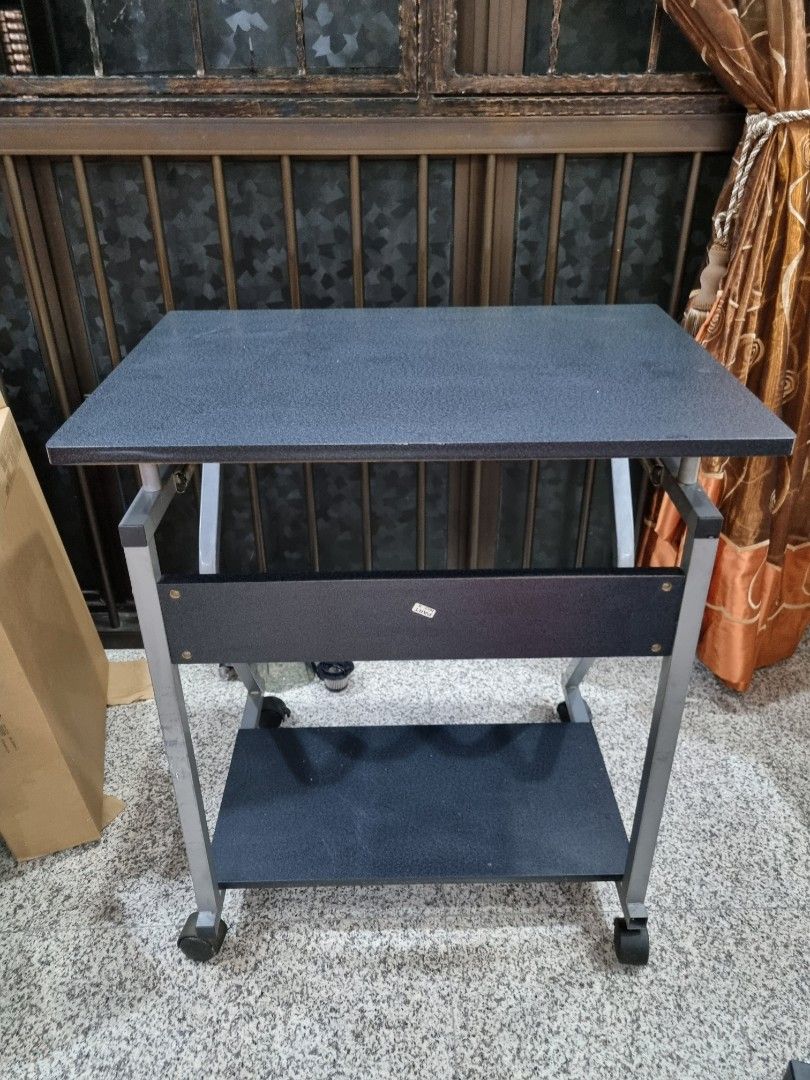 Computer Table (Category: Tables & Sets) located in Singapore. Submitted by shreddeduser (Listing ID 1321812029, Image 3). Description: Computer desk still in good condition. ( 20 × 27.5 × 28 ) Have abit of Minor Defect on the wood but overall still in good condition. Wheels and roller still in good conditon as well. Able to nego Self collection.
