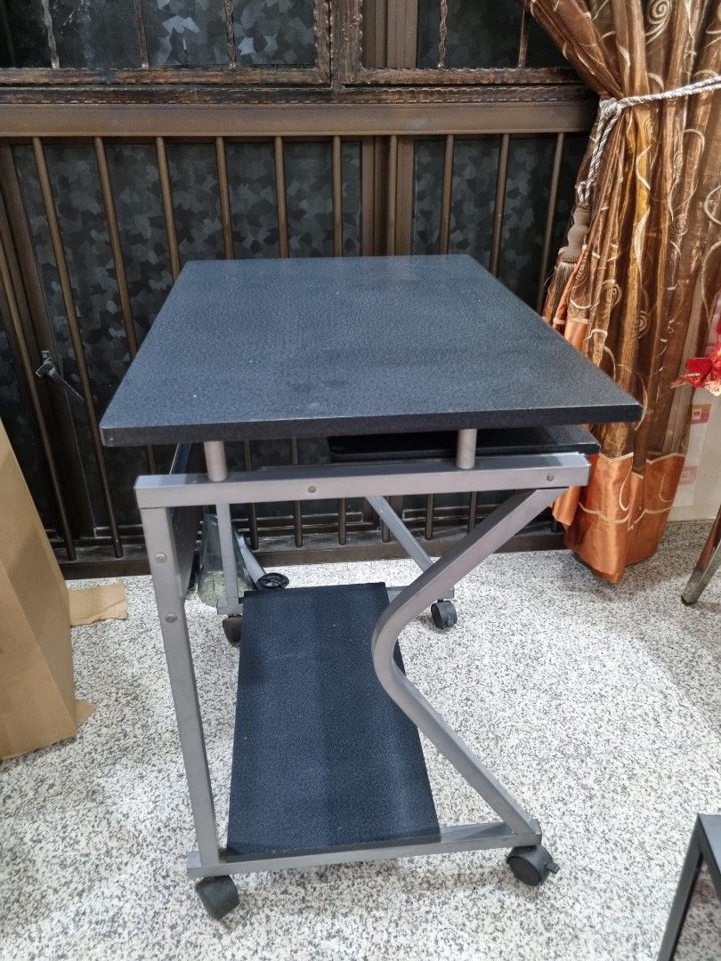 Computer Table (Category: Tables & Sets) located in Singapore. Submitted by shreddeduser (Listing ID 1321812029, Image 2). Description: Computer desk still in good condition. ( 20 × 27.5 × 28 ) Have abit of Minor Defect on the wood but overall still in good condition. Wheels and roller still in good conditon as well. Able to nego Self collection.